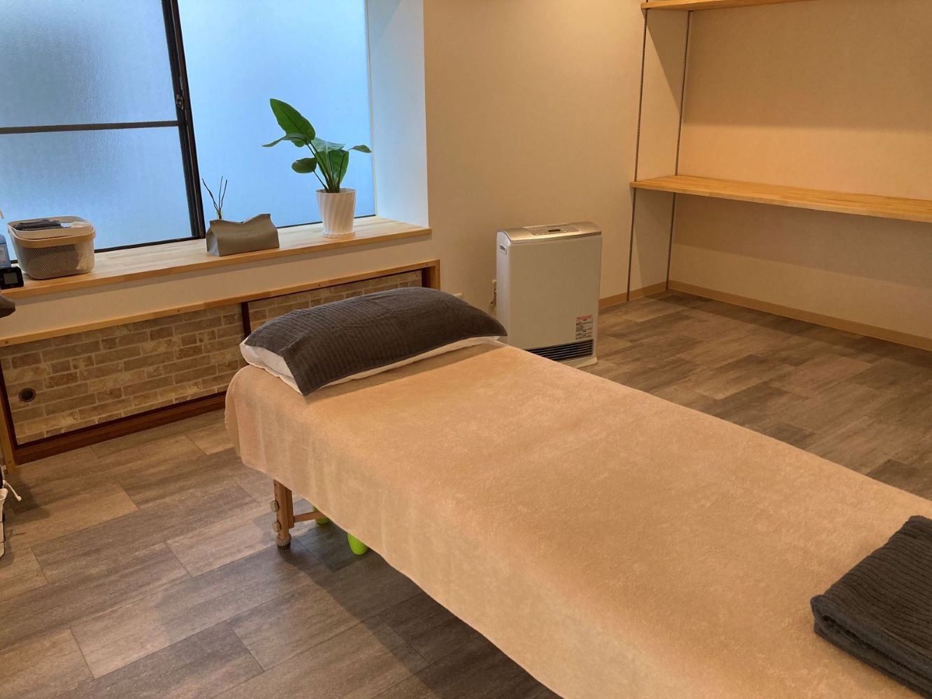 手技整体の施術シーン（肩・背中のケア）